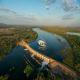 Flying over Lake Kununurra Diversion Dam
 - The Full Katherine Gorge Experience - KG20 HeliSpirit